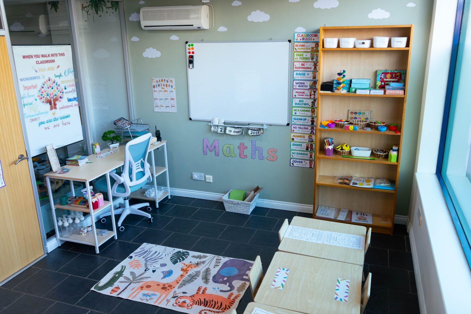 Wisdom Valley classroom for children aged 3–5 at Little Lion Cubs Nursery in Netherfield, Nottingham, featuring a maths learning area, whiteboard, child-sized tables, and organised educational resources.